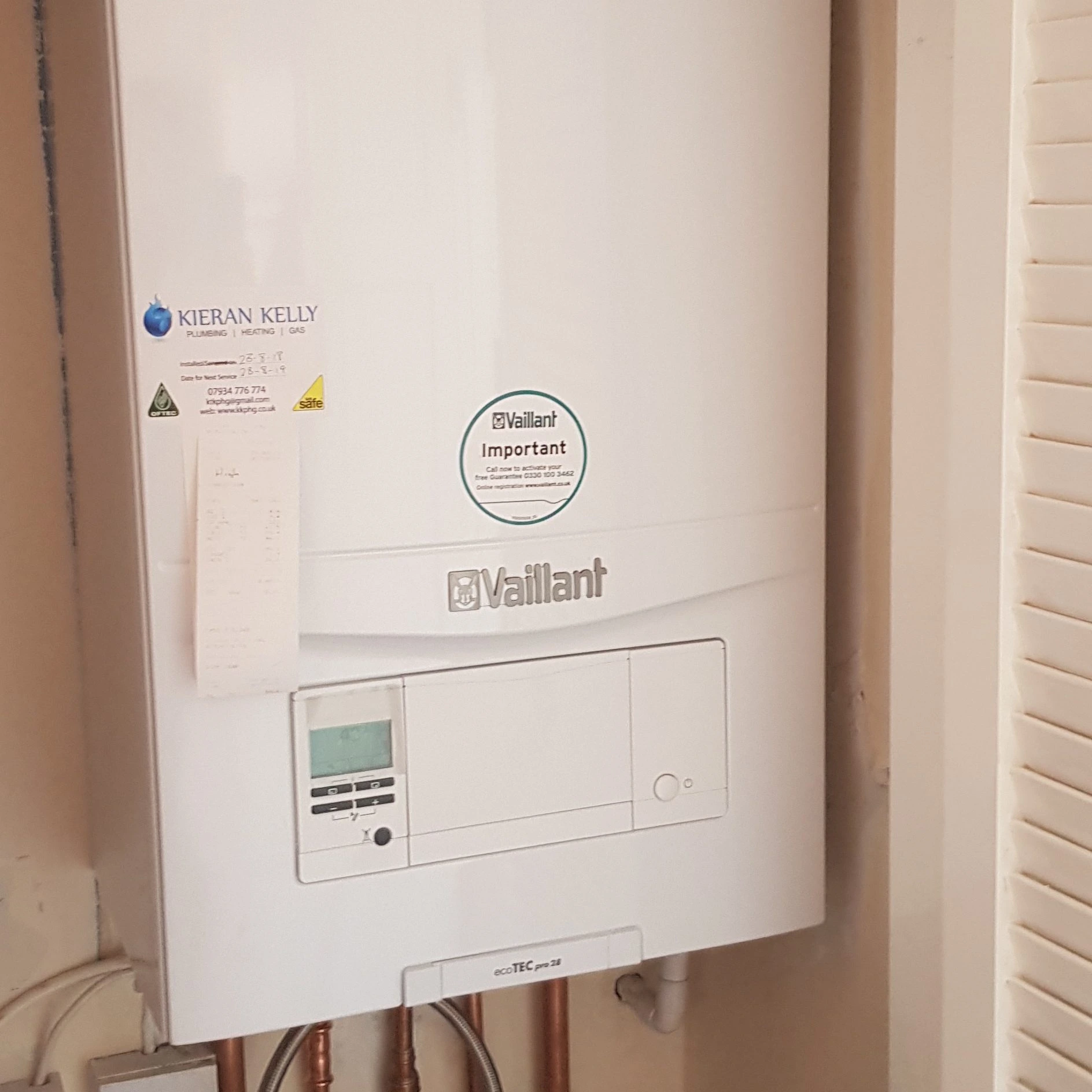 Vaillant ecoTEC boiler installed in Belfast with Kieran Kelly Gas Safe and OFTEC service labels — Kelly Heating NI